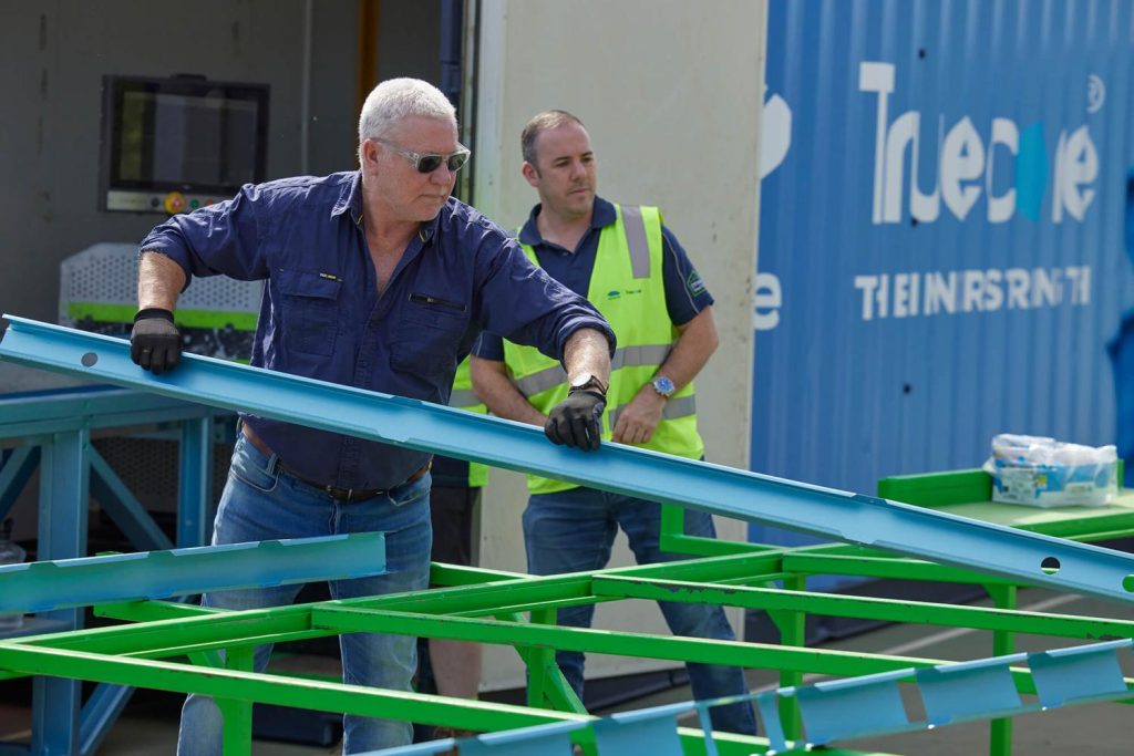 Peter Blythe and Scott Cam assemble wall frames for House 3. 